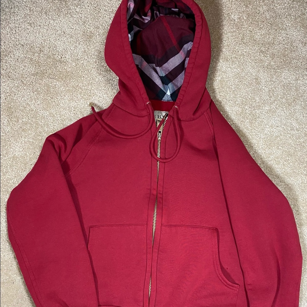Burberry hoodie. In great shape overall. One small pinhole. Otherwise perfect.